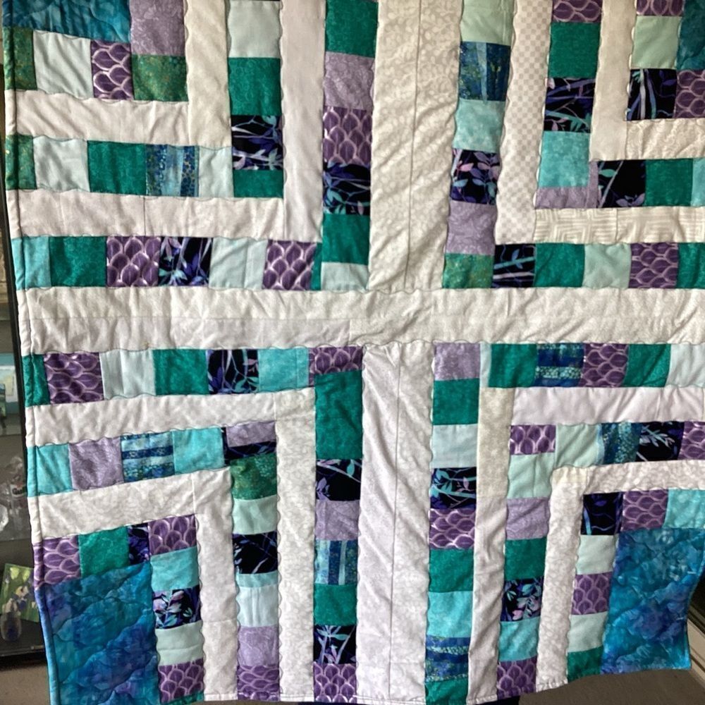 NWT. Hand Crafted Quilt of Blues, Purples and Turquoises